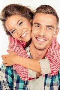 young couple smiling happily together